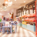 Blurred, colorful and beautiful candy store with people