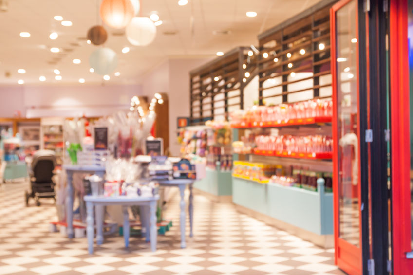 Blurred, colorful and beautiful candy store with people