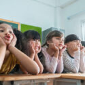 Portrait of Cheerful Multi-ethnic school kids in classroom, Smiling Faces