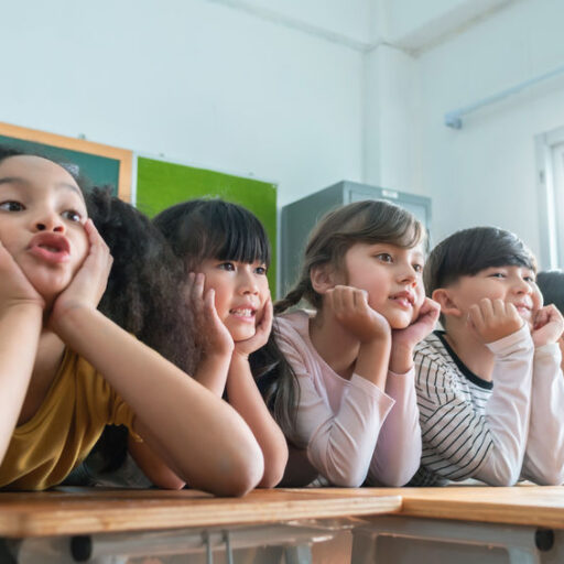 Portrait of Cheerful Multi-ethnic school kids in classroom, Smiling Faces