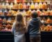 Boy and Girl looking at candy display in candy store